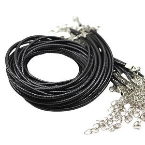 Detail of black braided leather cords with silver lobster clasps and extension chains