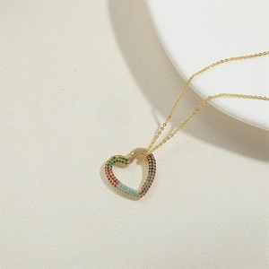 Chic golden necklace with a vibrant colorful heart pendant and sparkling multi-color stones