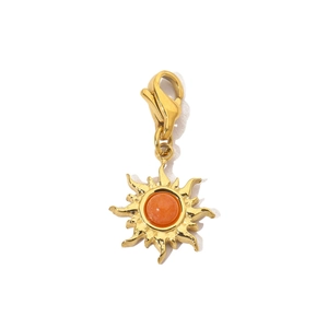 Detailed view of gold sun pendant with orange stone and stainless steel lobster clasp