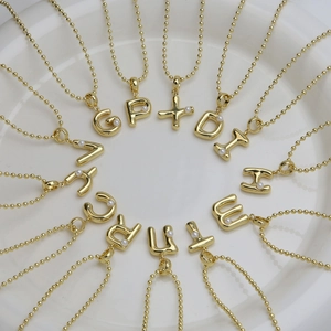 18k gold plated bubble letter necklace featuring round pearls and fine bead chain