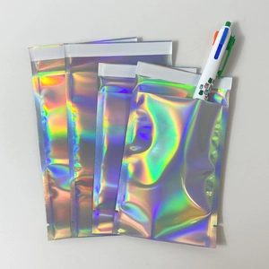 Laser holographic self-sealing mailers with rainbow glow effect and adhesive strip closure