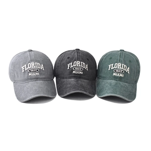 Three vintage washed cotton baseball caps with Florida embroidery in grey, black, and green