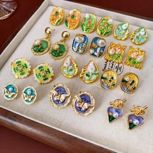 Assorted vintage enamel oil painting style earrings with pearls and floral designs