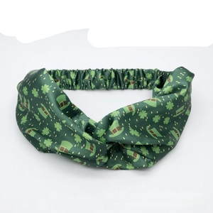 Detail of St. Patrick's Day headband with clover patterns and elastic band