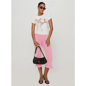 Detail view of pink cropped flare pants with bow tie waist and side slit design