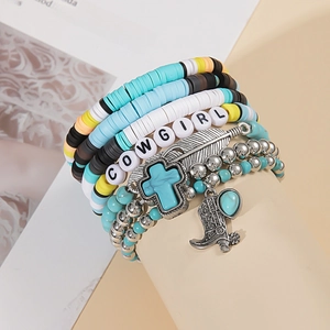 Detail of multi-layer western bracelet featuring turquoise beads and COWGIRL letter beads