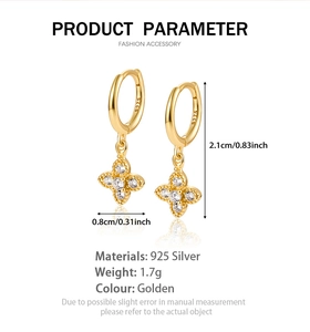 Detailed view of gold 925 sterling silver four-leaf clover earrings with zircon inlay