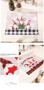 Macro detail of Christmas gnome placemat featuring burlap texture and plaid border
