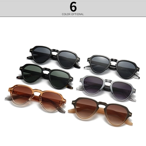 Detail view of round vintage sunglasses in six colors with metal arrow decorations