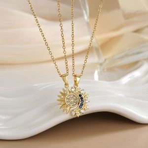 Detail of sun and moon pendant necklaces with micro-set zircon on gold cross chains