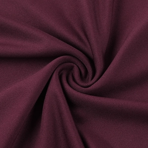 Close-up of deep purple ribbed knit fabric texture showing fine vertical patterns