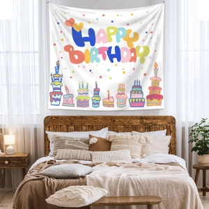 Detail of bohemian Happy Birthday tapestry with colorful cake and candle patterns