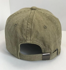 Close-up of olive green vintage baseball cap showing the fabric strap and metal buckle