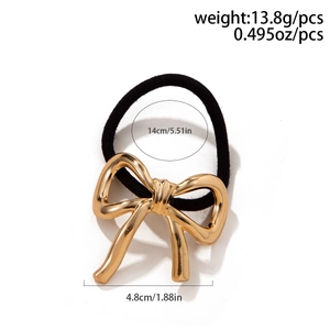 Detailed view of black elastic hair tie with gold alloy bow showing 4.8cm width dimensions