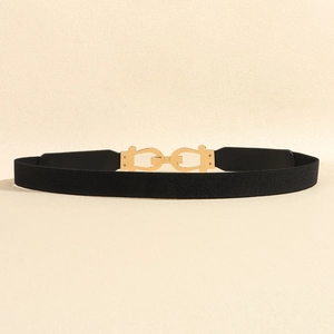 Detail of a 2.5cm black elastic waist belt featuring a polished gold double Gancini buckle