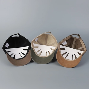 Detail view of cotton baseball caps interior construction with adjustable metal buckles