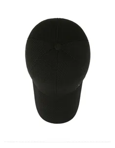 Top view of black baseball cap showing six-panel stitch detail and metal logo accent