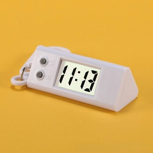 Macro detail of portable triangle digital watch with LCD screen and functional side buttons