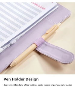 Detail of purple faux leather A5 binder featuring an elastic pen holder and stitching