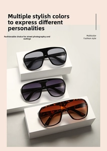 Close-up of oversized aviator sunglasses in black, purple gradient and tortoiseshell