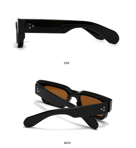 Detail view of black rectangular sunglasses with silver decorative triple rivets