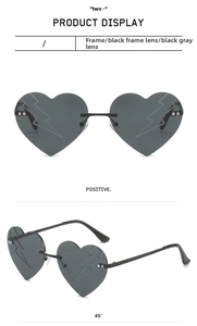 Frameless heart sunglasses with black-grey lenses and decorative lightning bolt patterns