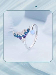 Macro shot of S925 sterling silver mermaid tail ring with blue opal and enamel