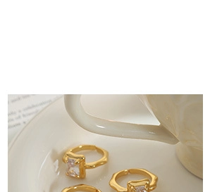 Detailed view of 18K gold plated crinkle rings with heart and rectangle crystals
