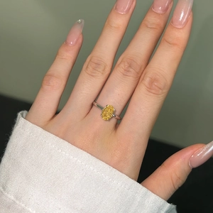 Macro detail of oval yellow gemstone ring with 8A ice flower cut on S925 sterling silver band
