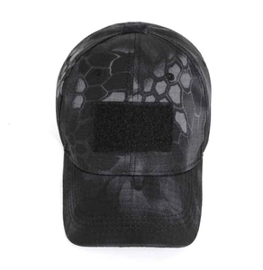 Macro detail of camouflage tactical cap featuring front loop fastener for patches
