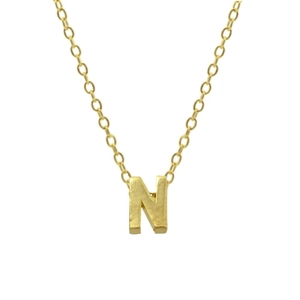 Macro shot of gold 925 sterling silver chain featuring a polished letter N pendant charm