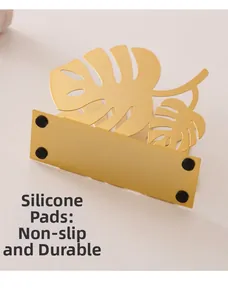 Detail of Nordic golden monstera leaf tissue holder with non-slip silicone foot pads