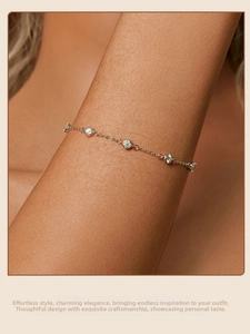 Detail macro shot of s925 sterling silver bracelet with five sparkling moissanite stones