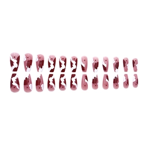 Long trapezoid press-on nails with amber marble smudge design in red and white
