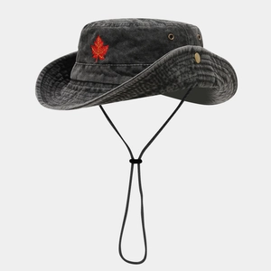 Detailed embroidery of a red maple leaf on a charcoal grey washed cotton bucket hat