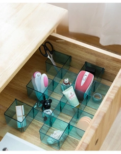 Detail view of dark green transparent drawer organizer for stationery and accessories