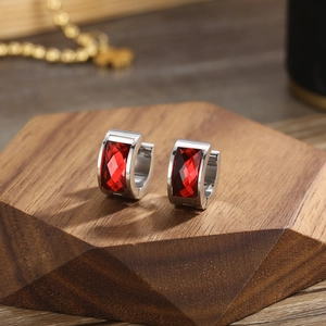 Polished silver stainless steel hoop earrings featuring rectangular red faceted zircon