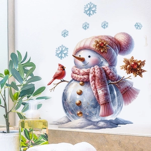 Close-up of Christmas snowman wall decal with pink scarf, red bird, and snowflakes
