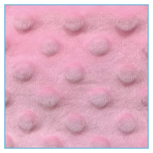 Macro shot of pink plush fabric with embossed dot texture for Christmas stockings