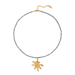 Detail of beaded ocean-themed necklace with gold sea turtle charm and turquoise stones