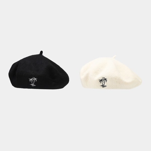 Women's vintage wool beret featuring coconut tree embroidery in black and beige