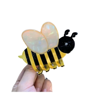 Striped bee acetate hair claw clip with iridescent translucent wings and rhinestone detail