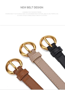 Detailed view of women's thin belts in brown, beige, and black with gold round buckles