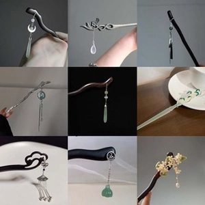 Detail view of various traditional Chinese hairpins featuring tassels and flower motifs