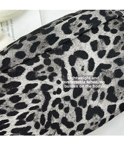 Close-up of lightweight leopard print canvas fabric with a fine wrinkled texture