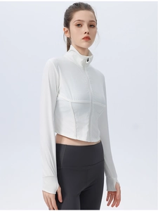 Close-up of white ribbed sports jacket with stand collar and functional thumbhole cuffs