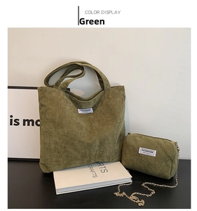 Detail view of olive green corduroy tote bag and small chain pouch set with fashion label