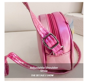 Detailed shot of pink metallic unicorn bag with adjustable shoulder strap and silver buckle
