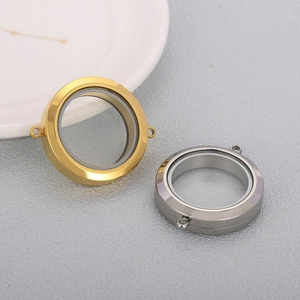 Polished gold and silver stainless steel screw glass locket pendants on a ceramic plate