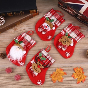 Detail of Christmas stockings with Santa, snowman, and reindeer 3D character motifs